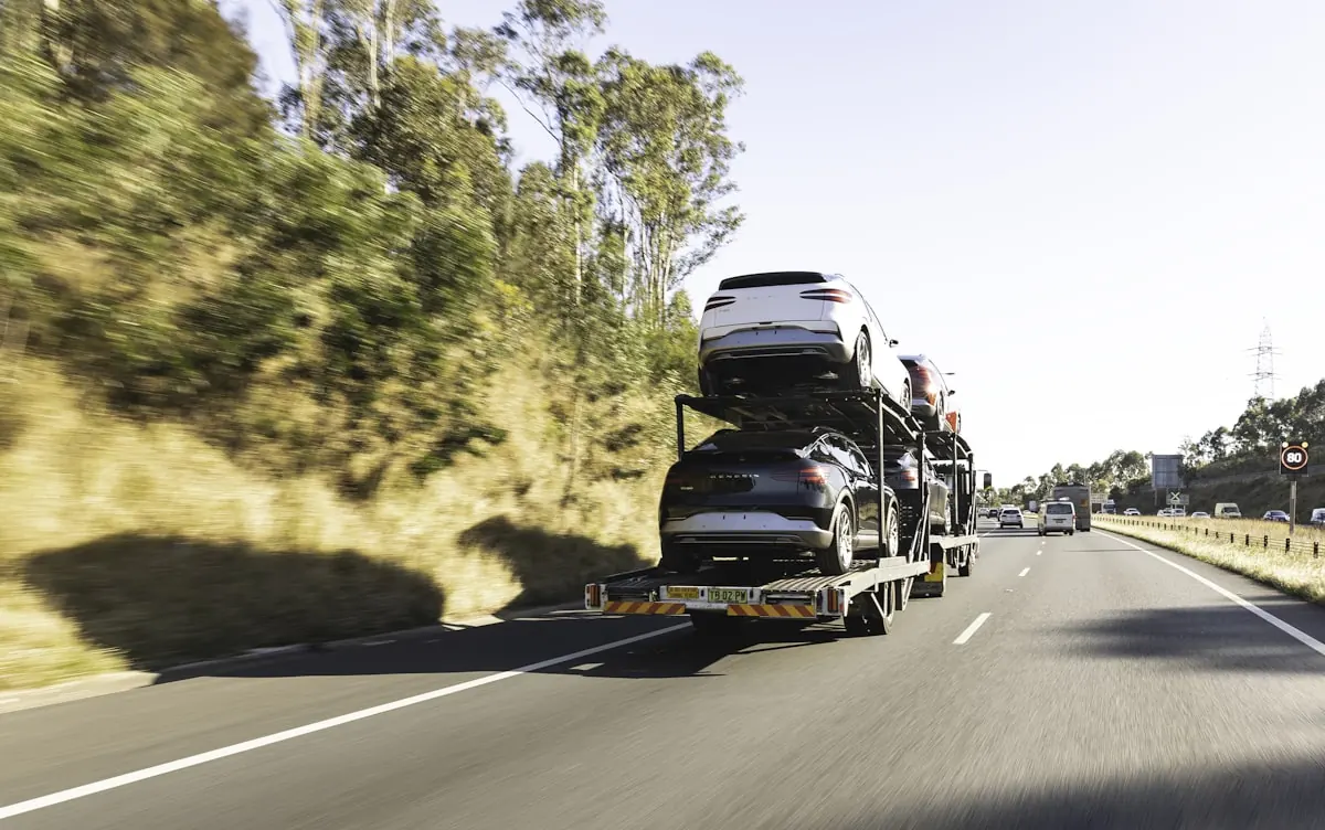 Vehicles on a car transport trailer Vehicles on a car transport trailer