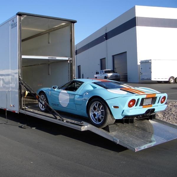 Sports car being loaded into an enclosed auto transport trailer Sports car being loaded into an enclosed auto transport trailer