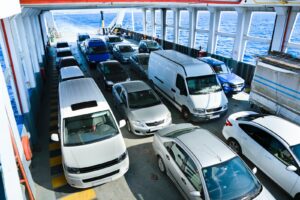 Rows of cars parked on the vehicle deck of a roll-on/roll-off ship