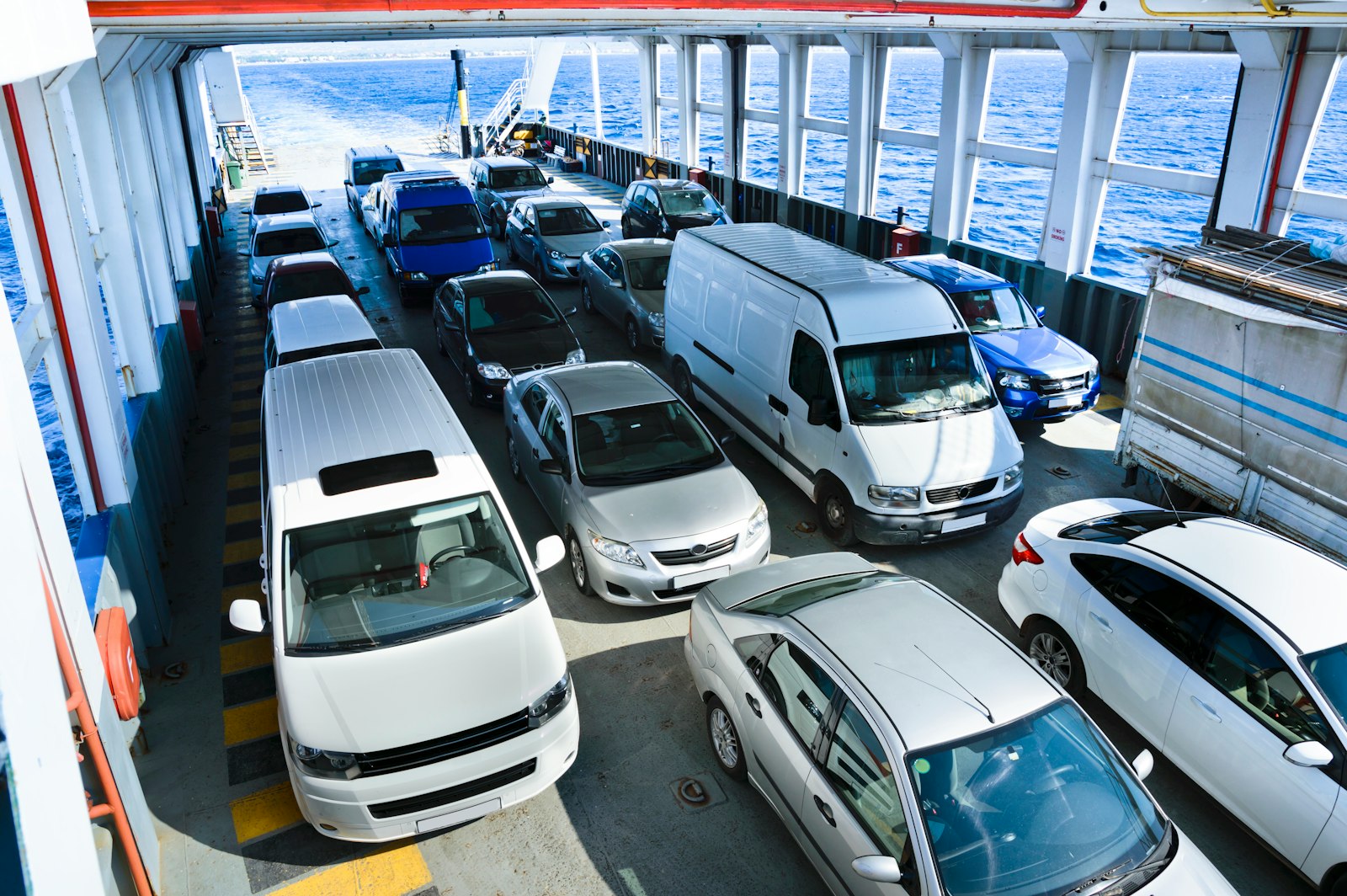Cars secured on the vehicle deck of a roll-on/roll-off ship