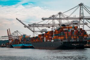 Stacked shipping containers on a cargo ship used for container car shipping