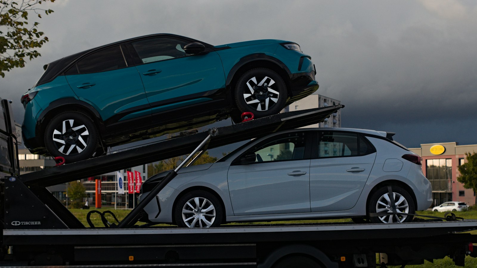 Car carrier truck delivering a car to the port for export from the USA