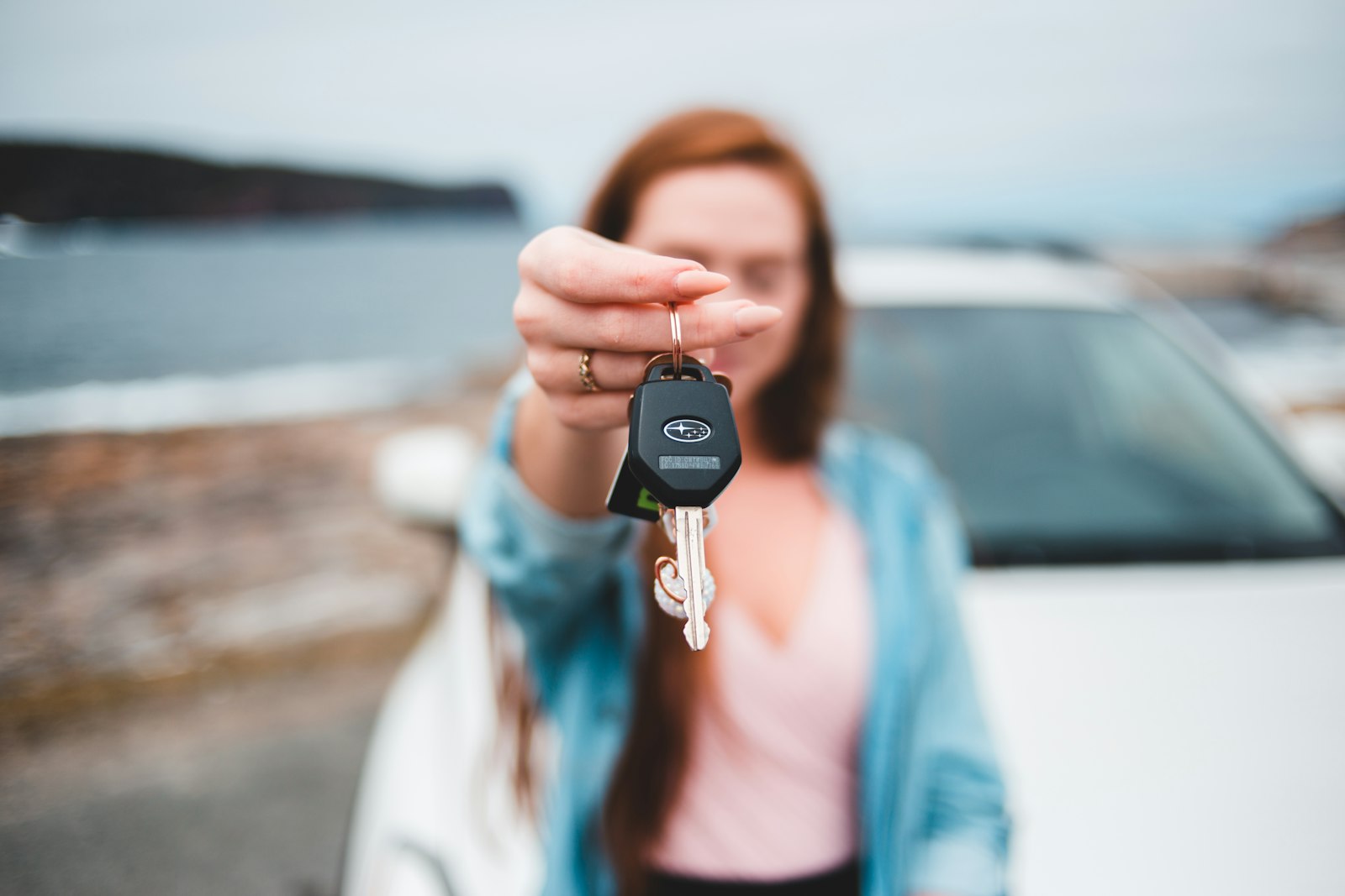 Car key handed over at delivery after car transport