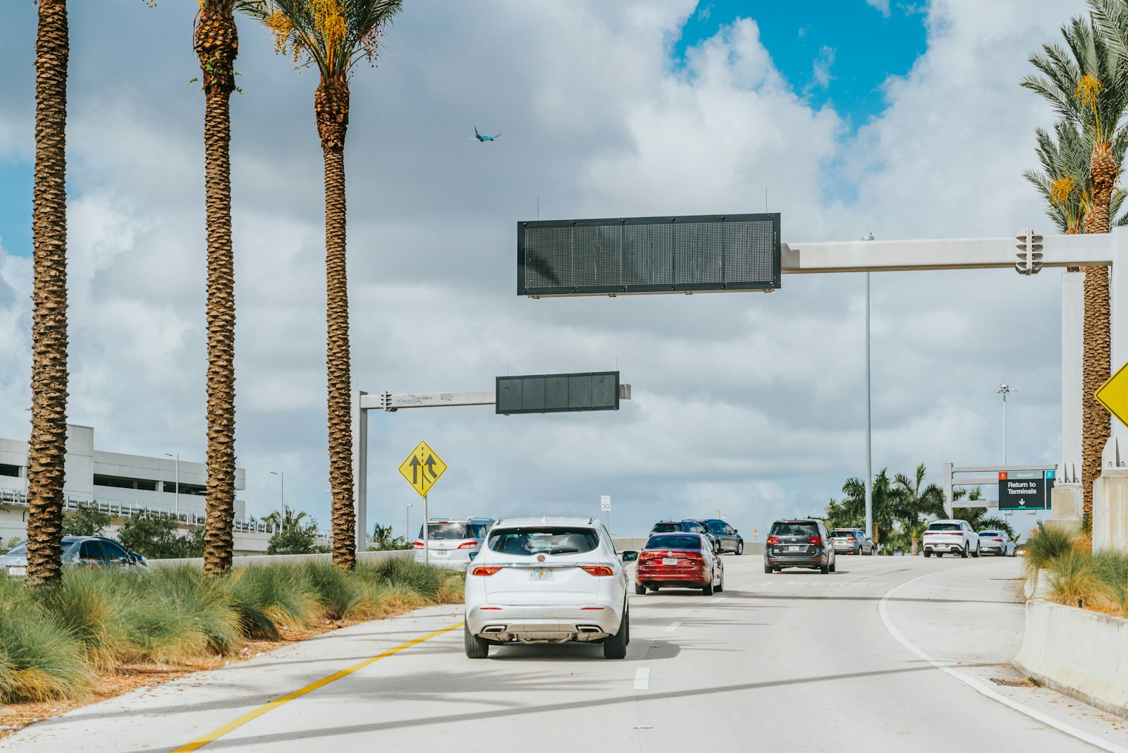 Used cars parked on a sunny street