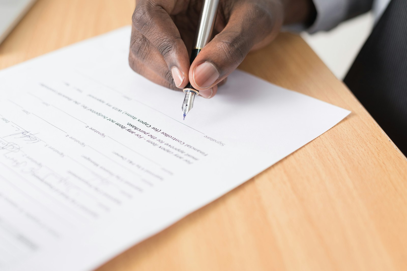 Reviewing car export documents and the vehicle title before shipping