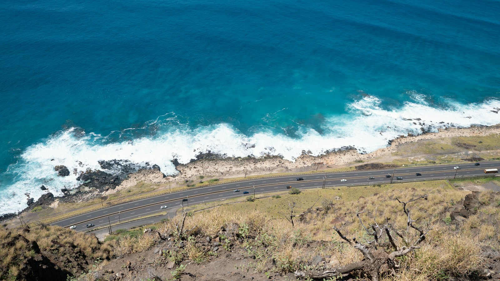 Aerial view of a Hawaii coastal road when moving to Hawaii with a car