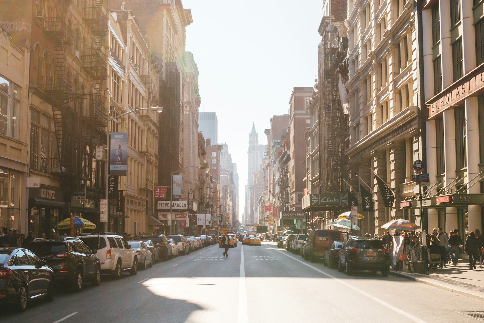 Cars and taxis on a busy Manhattan street when moving to New York with a car