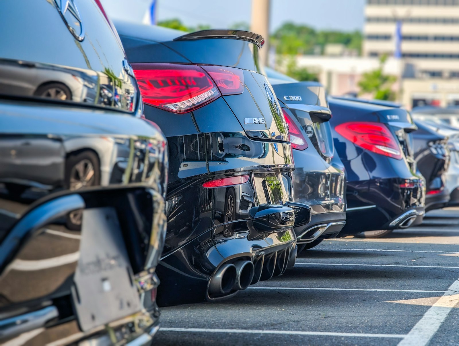 Used cars for sale lined up at a dealership