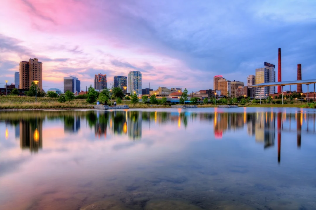 Birmingham, Alabama skyline reflected in water at sunset Birmingham, Alabama skyline reflected in water at sunset